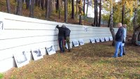 Участники проекта &quot;Art wall&quot; украсили стену у Камня основания города чёрно-белыми фотографиями